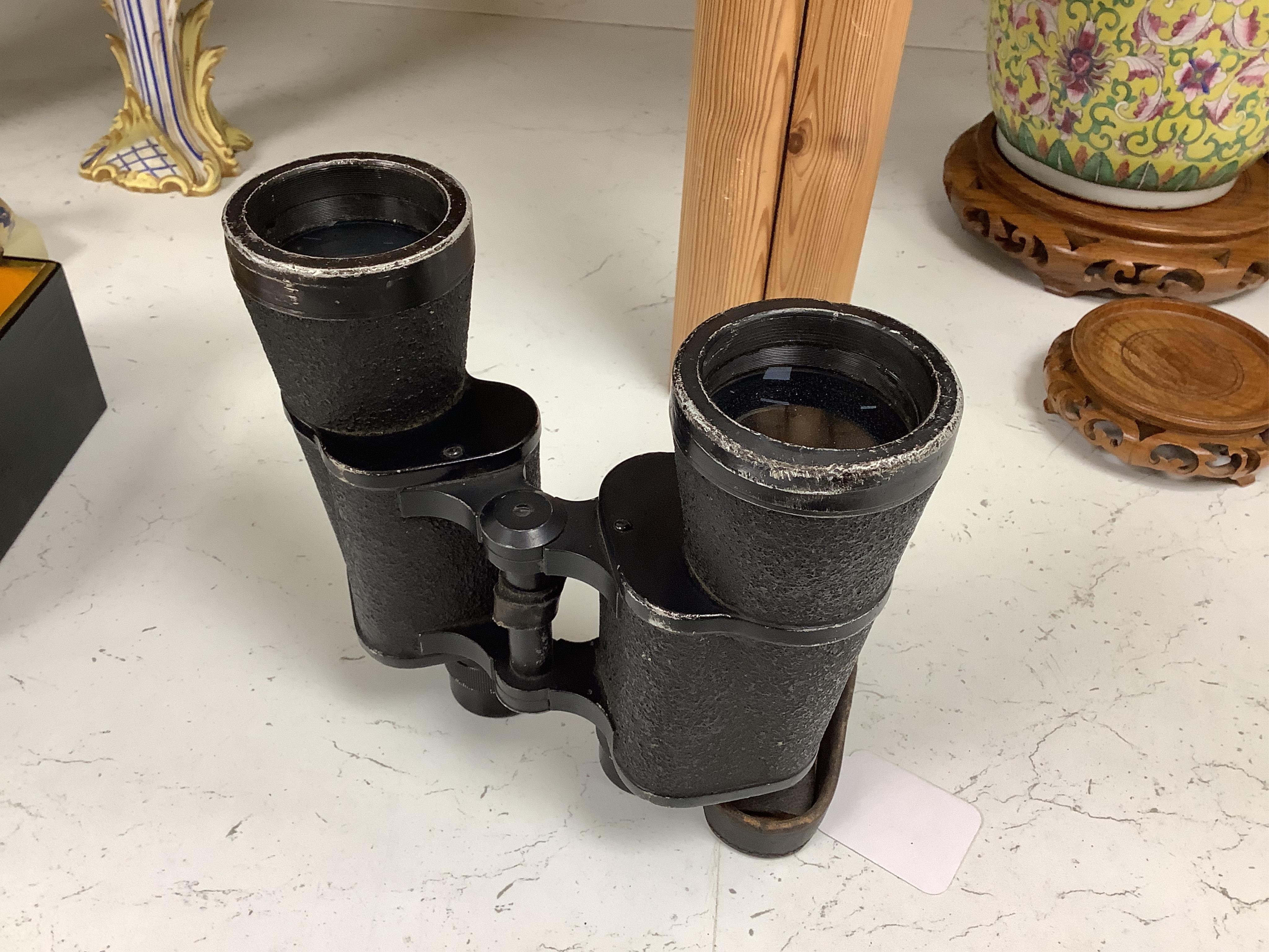 A pair of World War II German military binoculars, 17.5cm long. Condition - worn